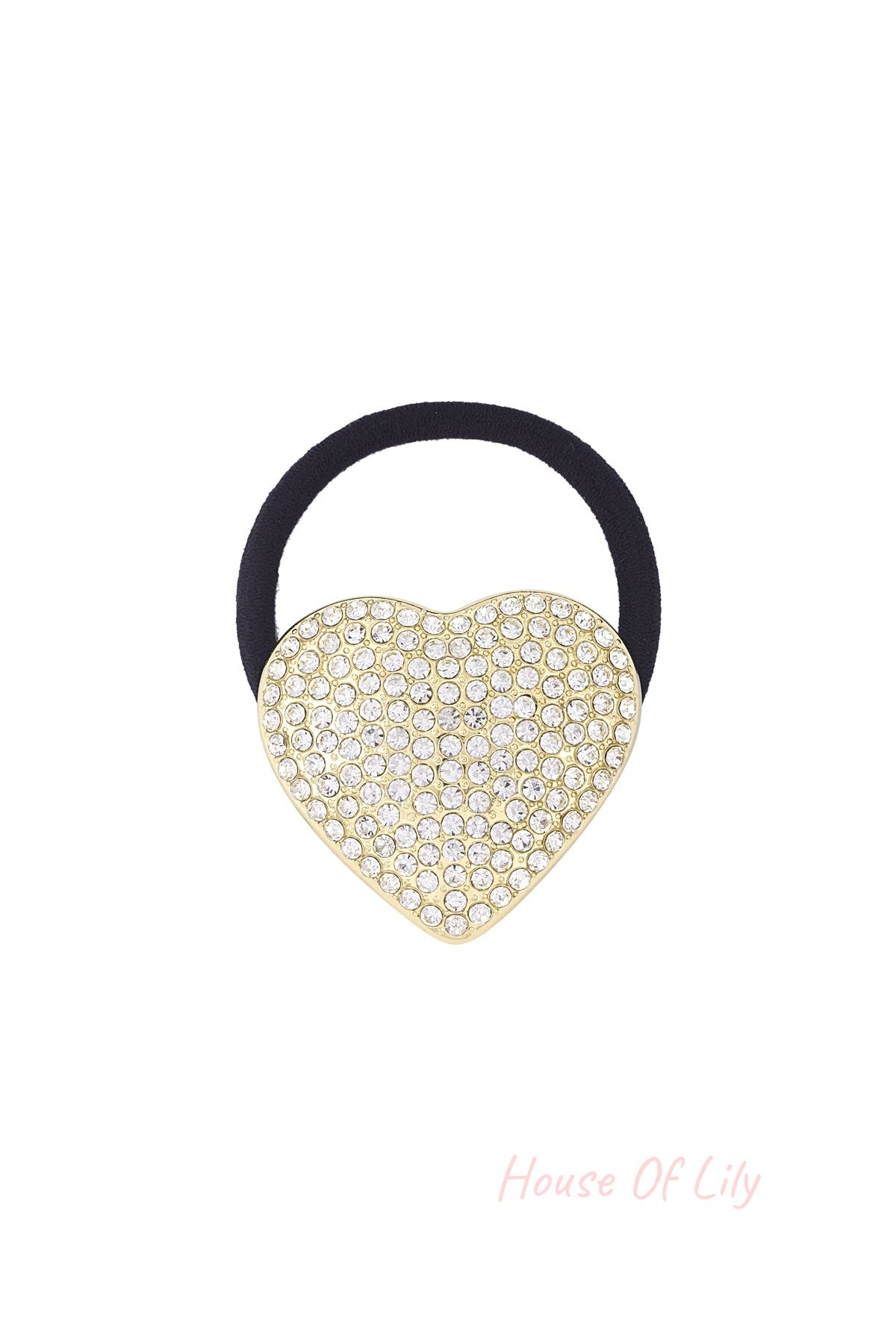 Close-up of a black elastic hair tie featuring a gold-tone heart charm encrusted with clear sparkling crystals