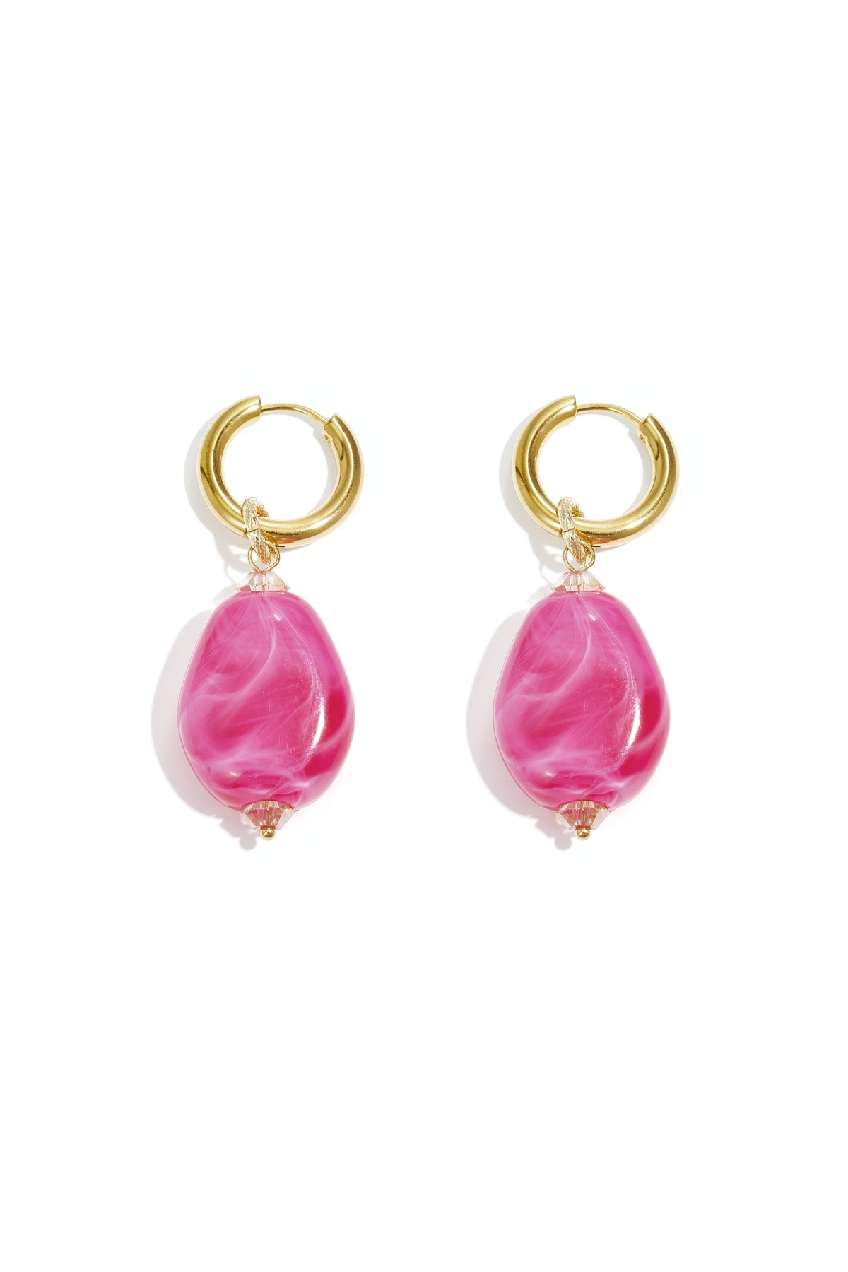 Pair of gold hoop earrings with large vibrant pink cloudy resin beads