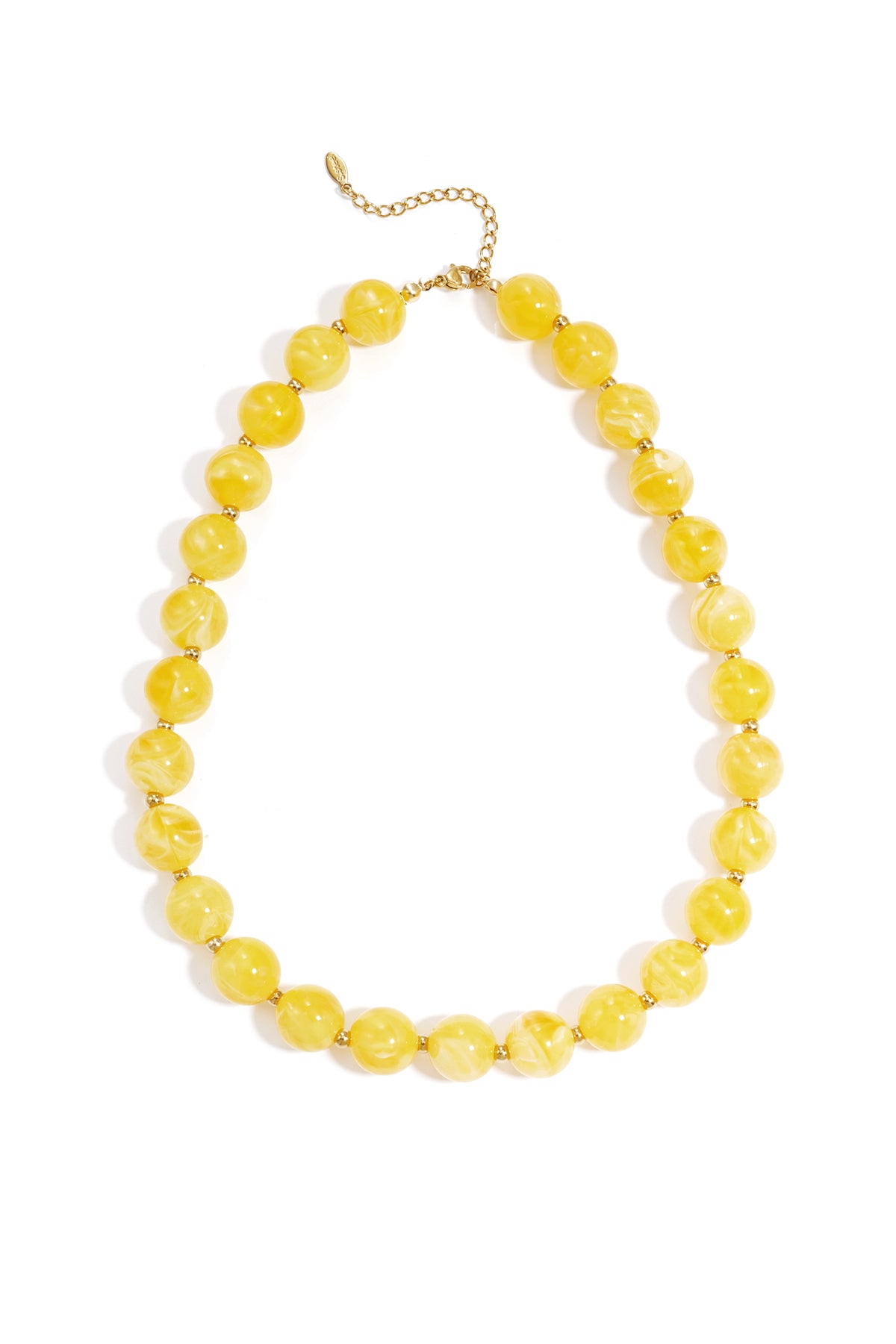 Marbled yellow round beaded necklace with gold spacers and a gold chain clasp on a white background.