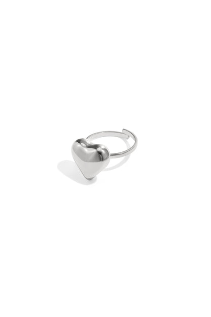 Silver puffy heart adjustable ring on white background