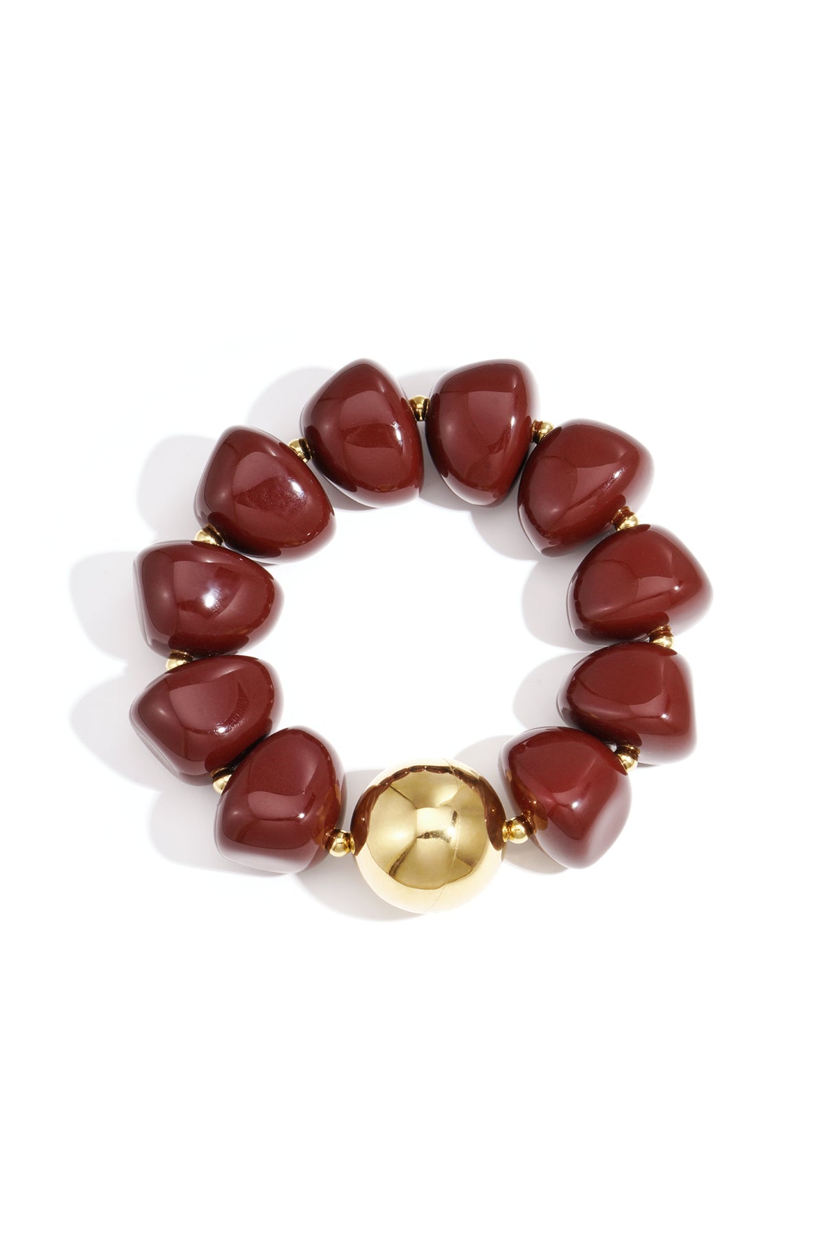 Close-up of chunky crimson acrylic beaded bracelet with one shiny gold bead