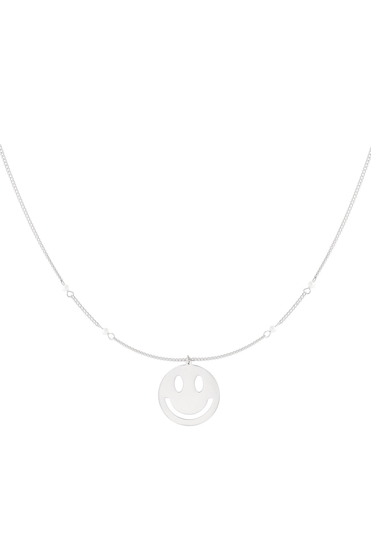 Silver version of the smiley face charm necklace featuring a delicate chain with small pearl accents