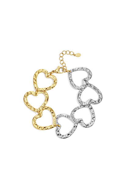 Two-tone hammered heart link bracelet showing gold and silver heart links on white background