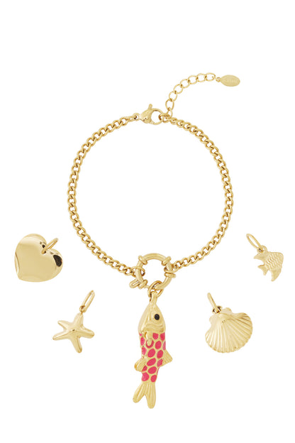 Gold plated charm bracelet with five ocean-themed charms including a pink enamel fish, starfish, shell, heart, and fish laid flat