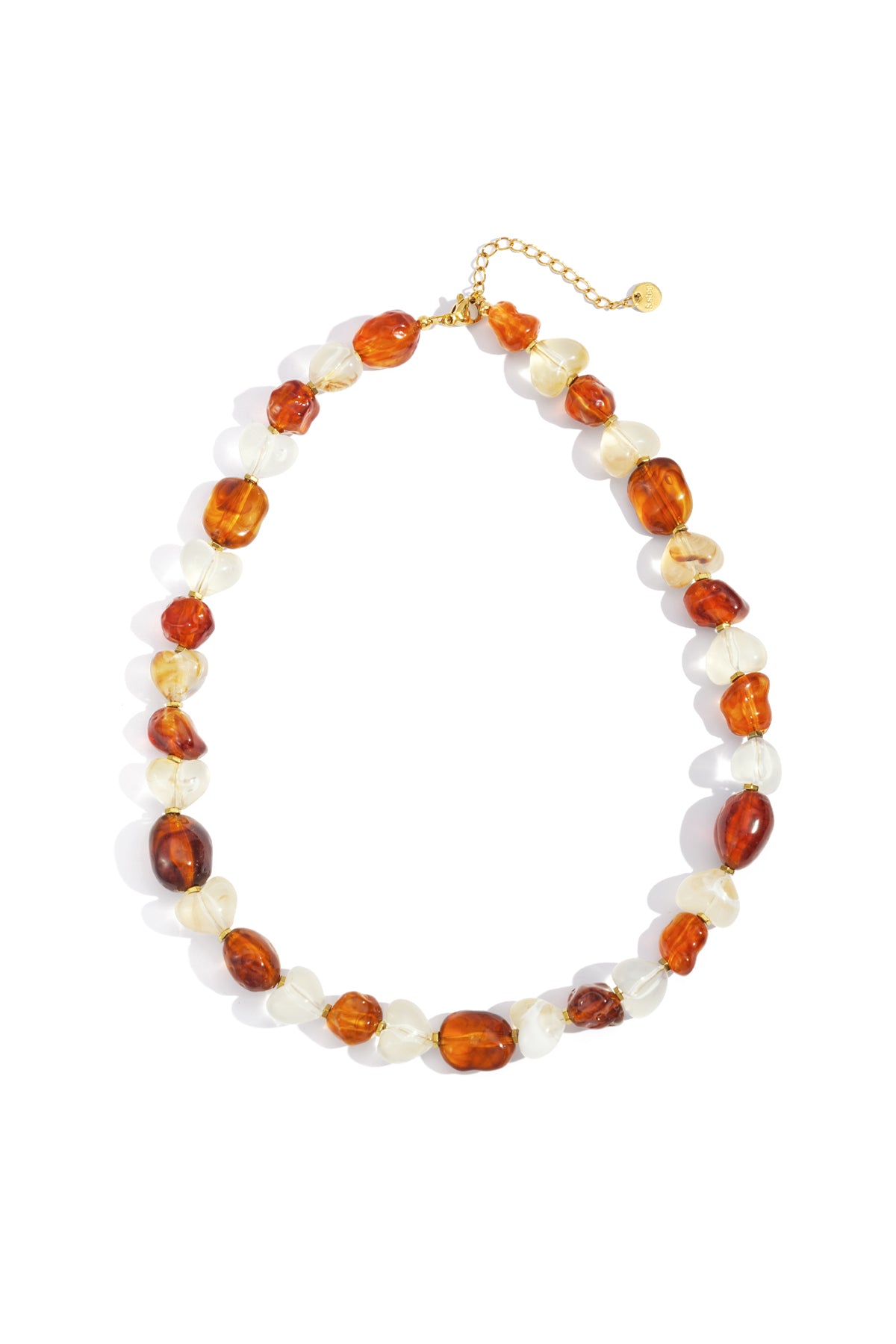 Amber and white acrylic heart and pebble-shaped beads necklace with gold chain extender on white background
