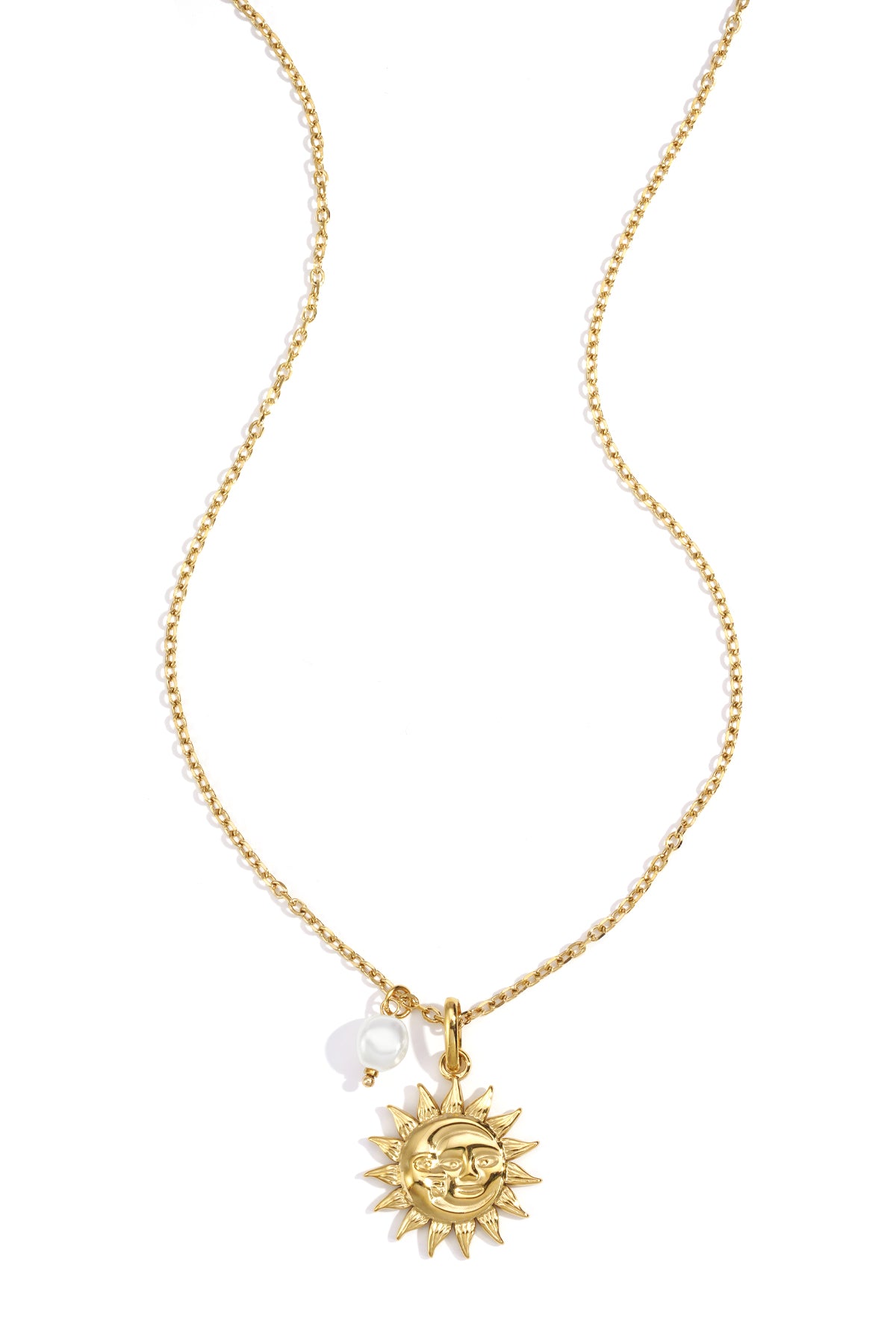 Gold-tone chain necklace with a smiling sun pendant and a small white pearl charm on a white background