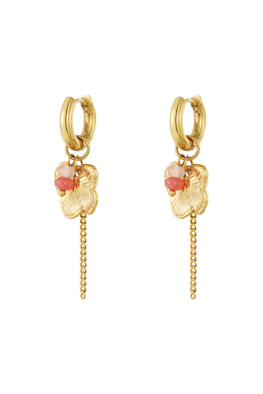 Pair of gold-tone floral drop earrings with pink gemstone beads and dangling chain detail on white background