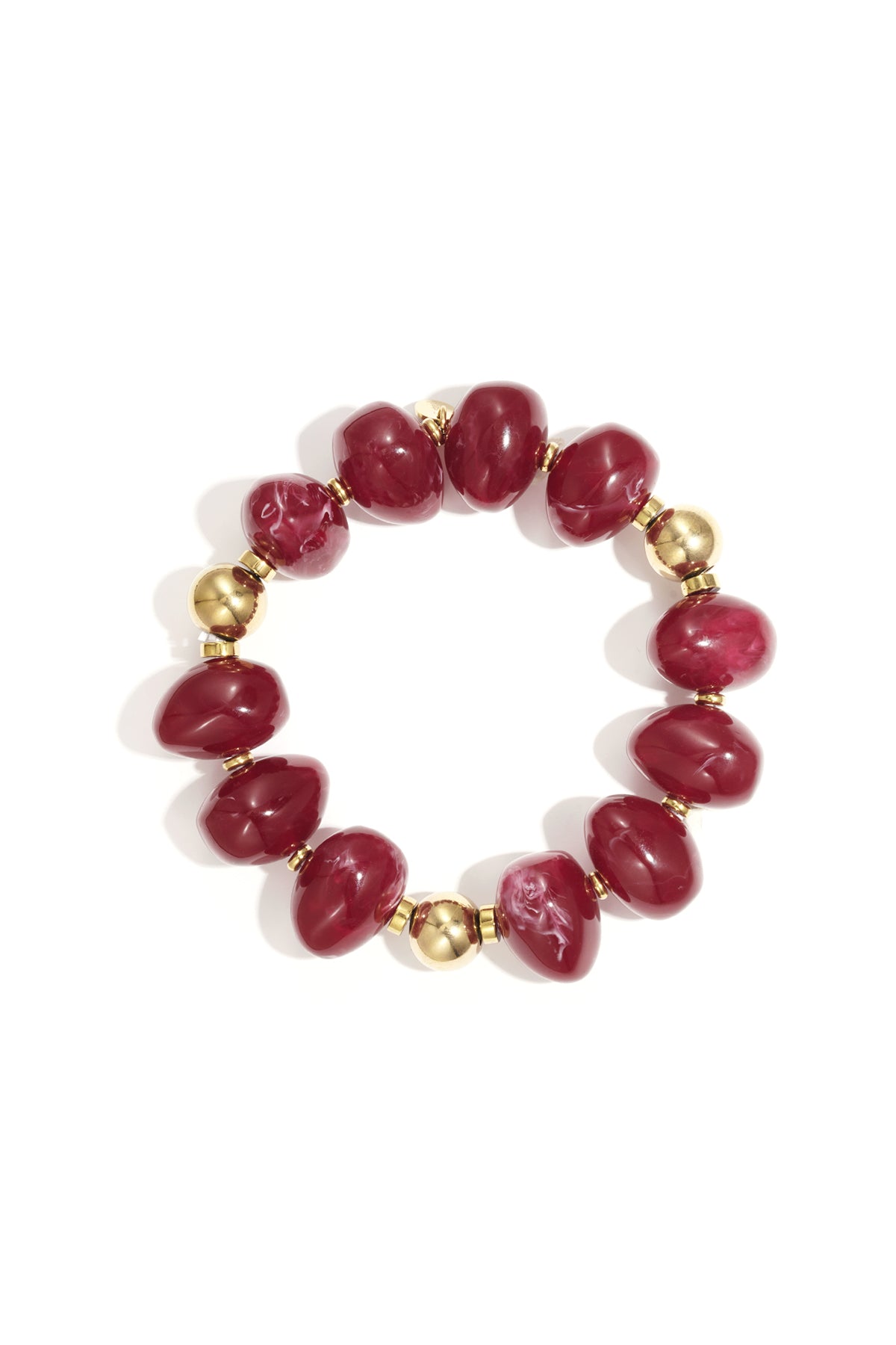 Red marbled resin beaded bracelet with gold beads on white background