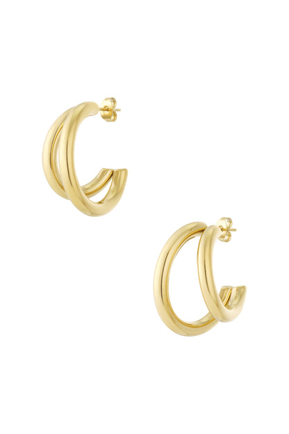 Gold chunky double hoop earrings with smooth polished finish isolated on white background