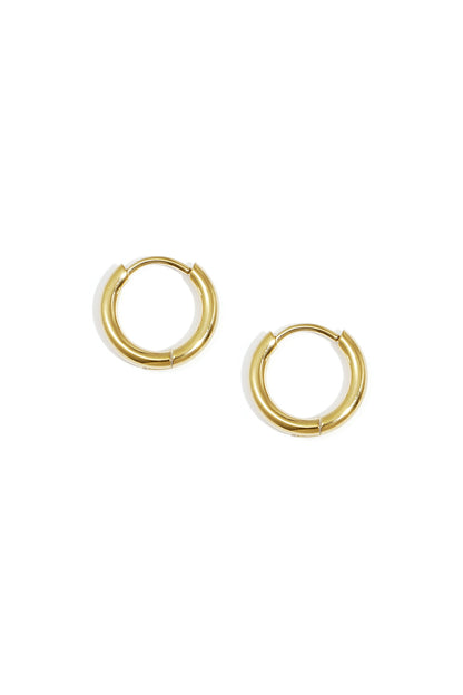 Pair of minimal classic gold hoop earrings on white background