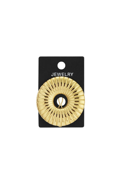 Gold-tone circle clip brooch with a radial striped, ribbed texture on a black jewelry display card.