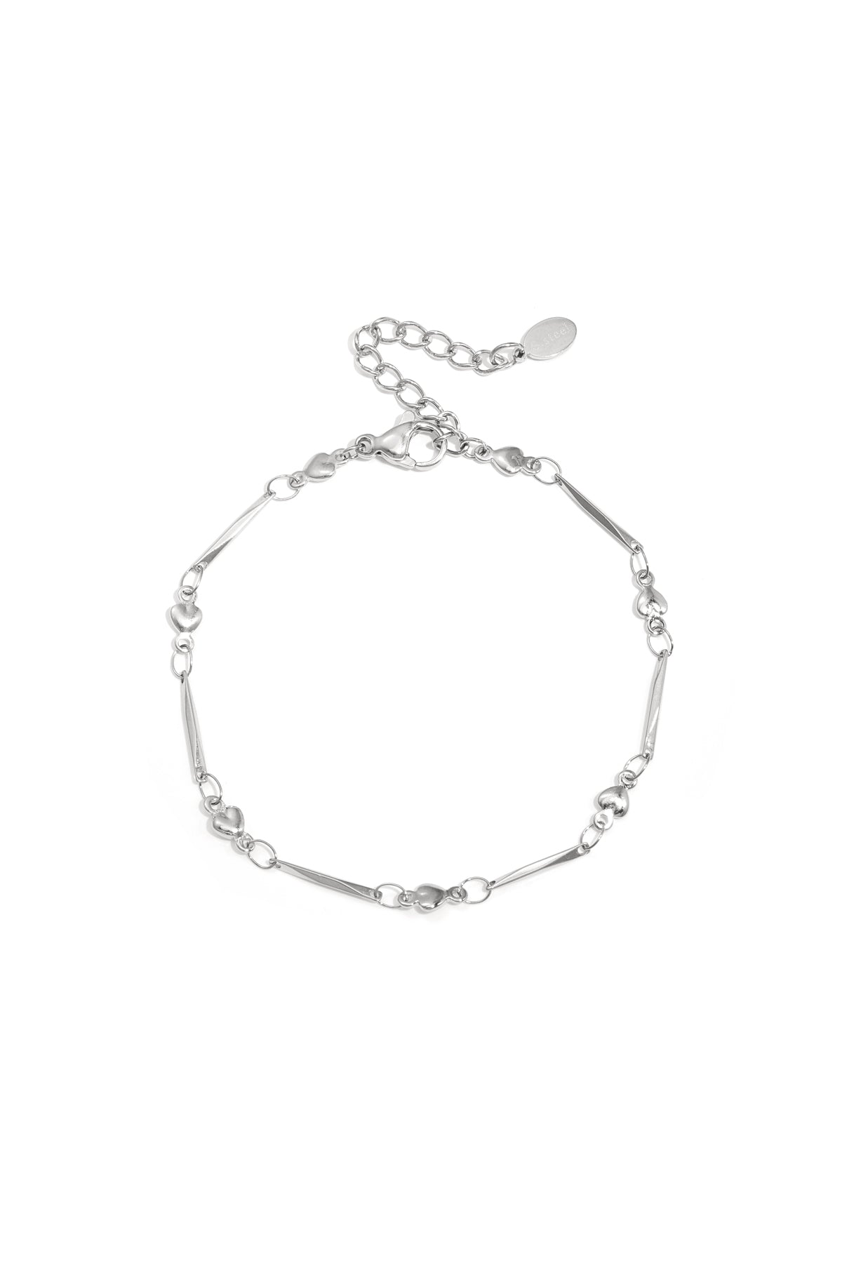 Close-up image of a delicate silver heart link bracelet with lobster clasp and adjustable chain on white background.