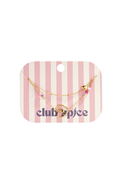 Delicate heart charm bracelet displayed on pink and white striped Club Spice branded packaging card