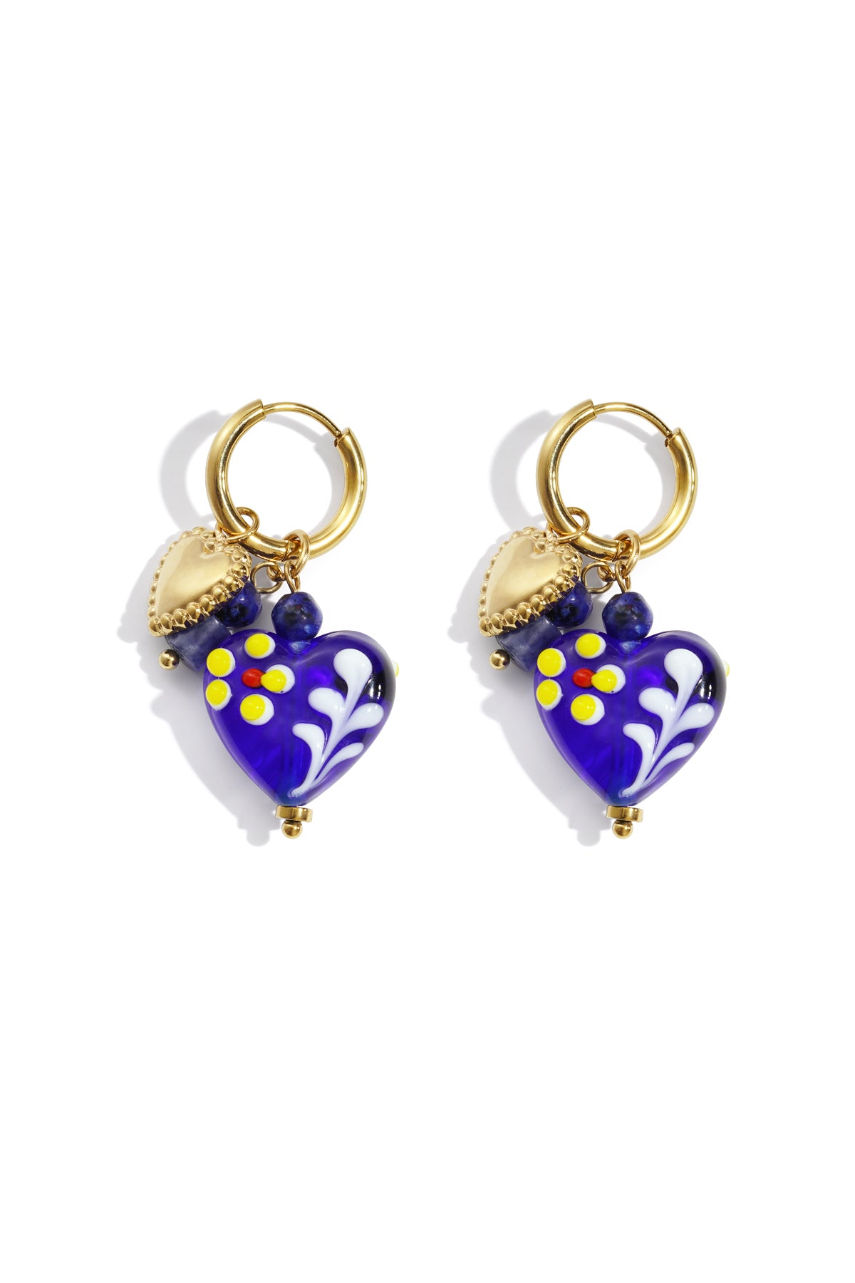 Pair of gold hoop earrings with royal blue glass heart charms decorated with yellow and red flowers and gold heart pendants