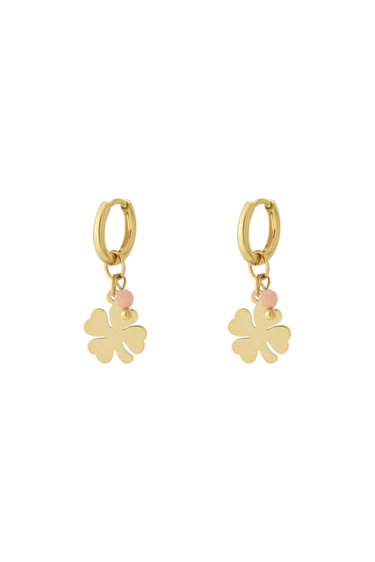 Pair of gold-plated drop earrings featuring four-leaf clover charm with soft pink bead accent on white background