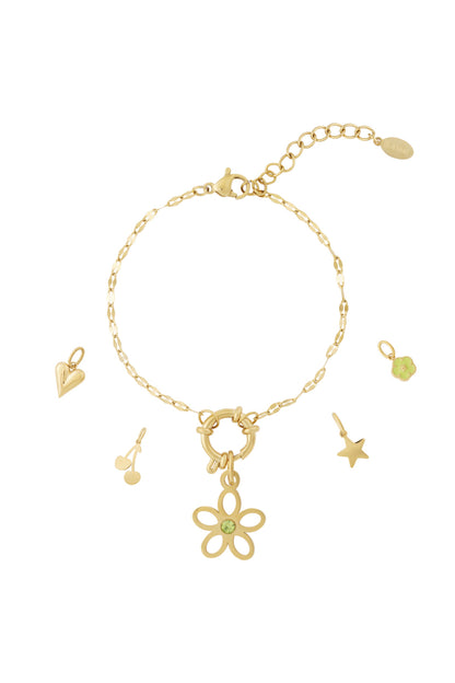 Gold chain bracelet with removable flower charm featuring a green gemstone, heart, cherry, star, and small flower charms displayed separately
