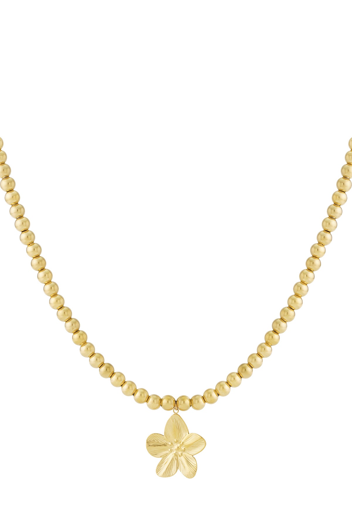 Close-up of gold beaded necklace with flower pendant on white background