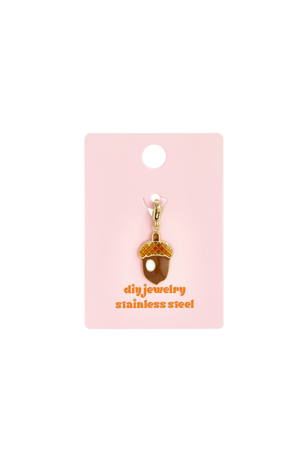 Cute Acorn Drop charm made of gold-tone stainless steel with brown and orange enamel details on a pink display card.
