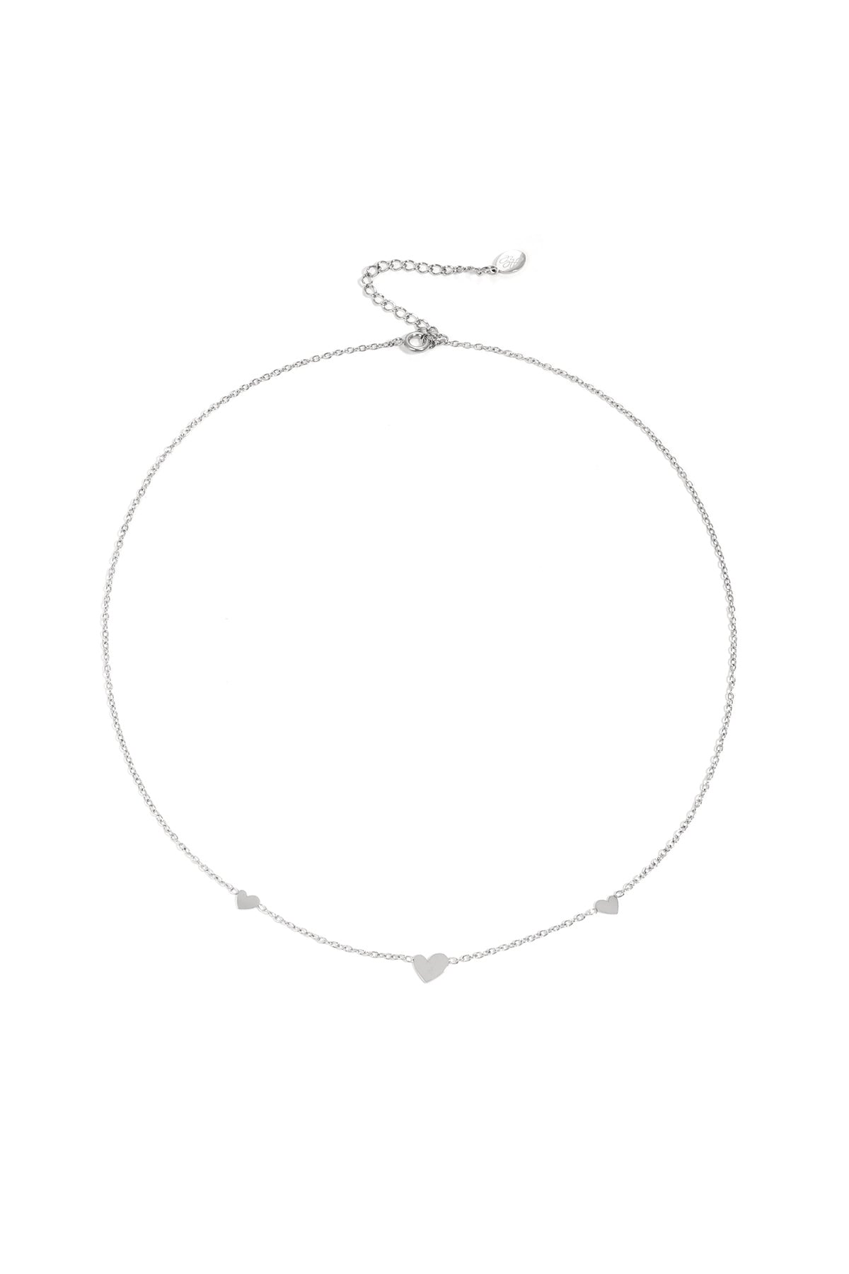 Silver heart charm chain necklace on white background