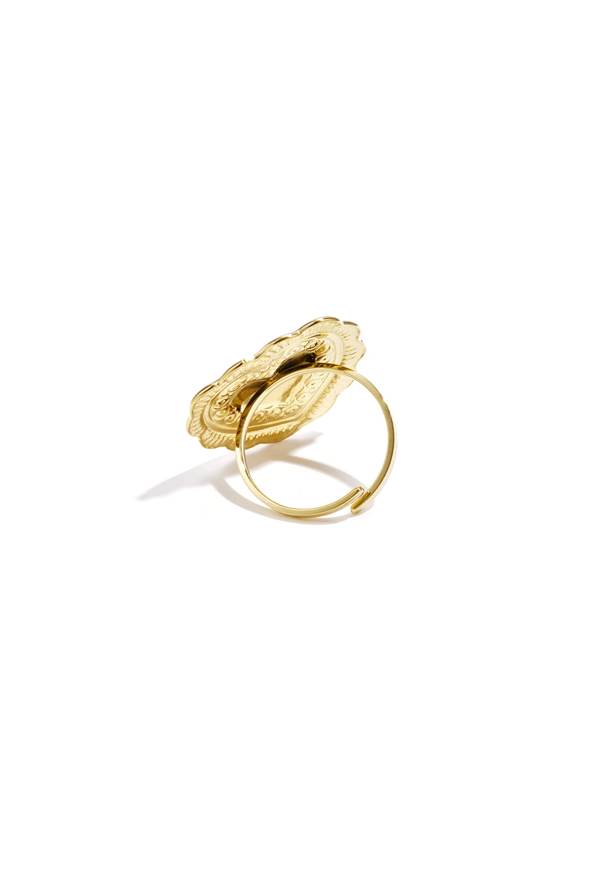 Hammered gold heart-shaped ring with an ornate, scalloped edge and a thin, adjustable gold band on a white background.