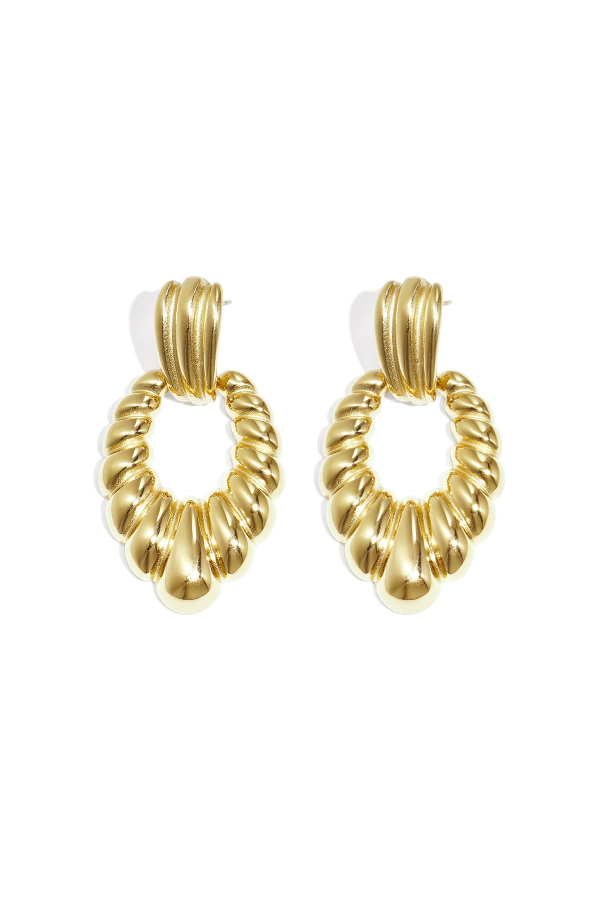 Pair of chic twisted gold hoop earrings displayed on a white background