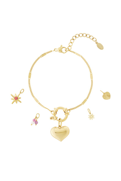 Gold chain charm bracelet with bold heart pendant and multiple separate gold and colorful charms for customization