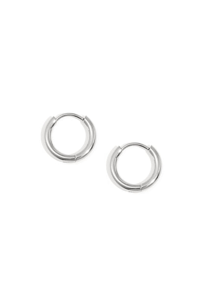 Pair of minimal classic silver hoop earrings on white background