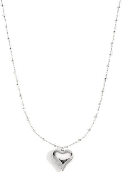Silver long necklace with polished heart pendant and small bead details on chain, displayed on white background