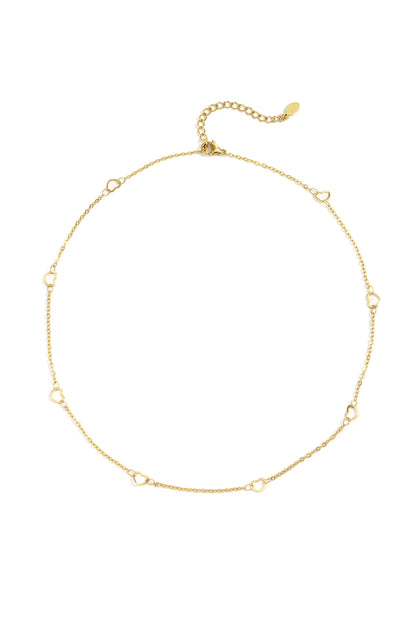 Gold-tone delicate chain necklace with small open heart accents evenly spaced on a white background