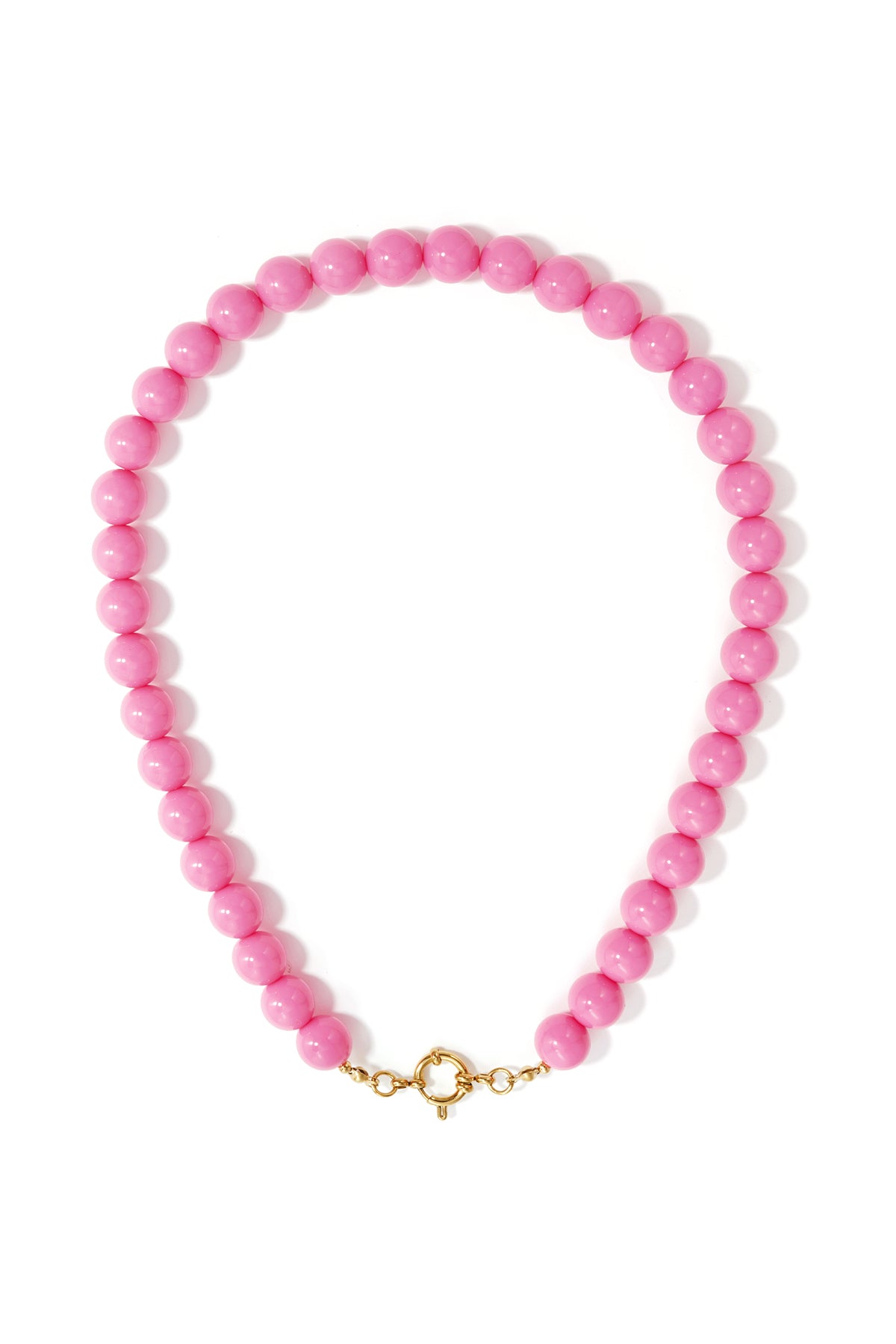 Single strand necklace with glossy pink resin beads and gold ring clasp on white background