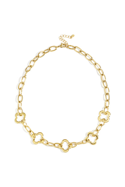 Gold-tone clover link chain necklace with polished oval links and clover accents displayed on a white background