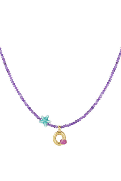 Purple beaded necklace featuring a gold letter 'O' charm, a small purple flower, and a turquoise starfish charm.