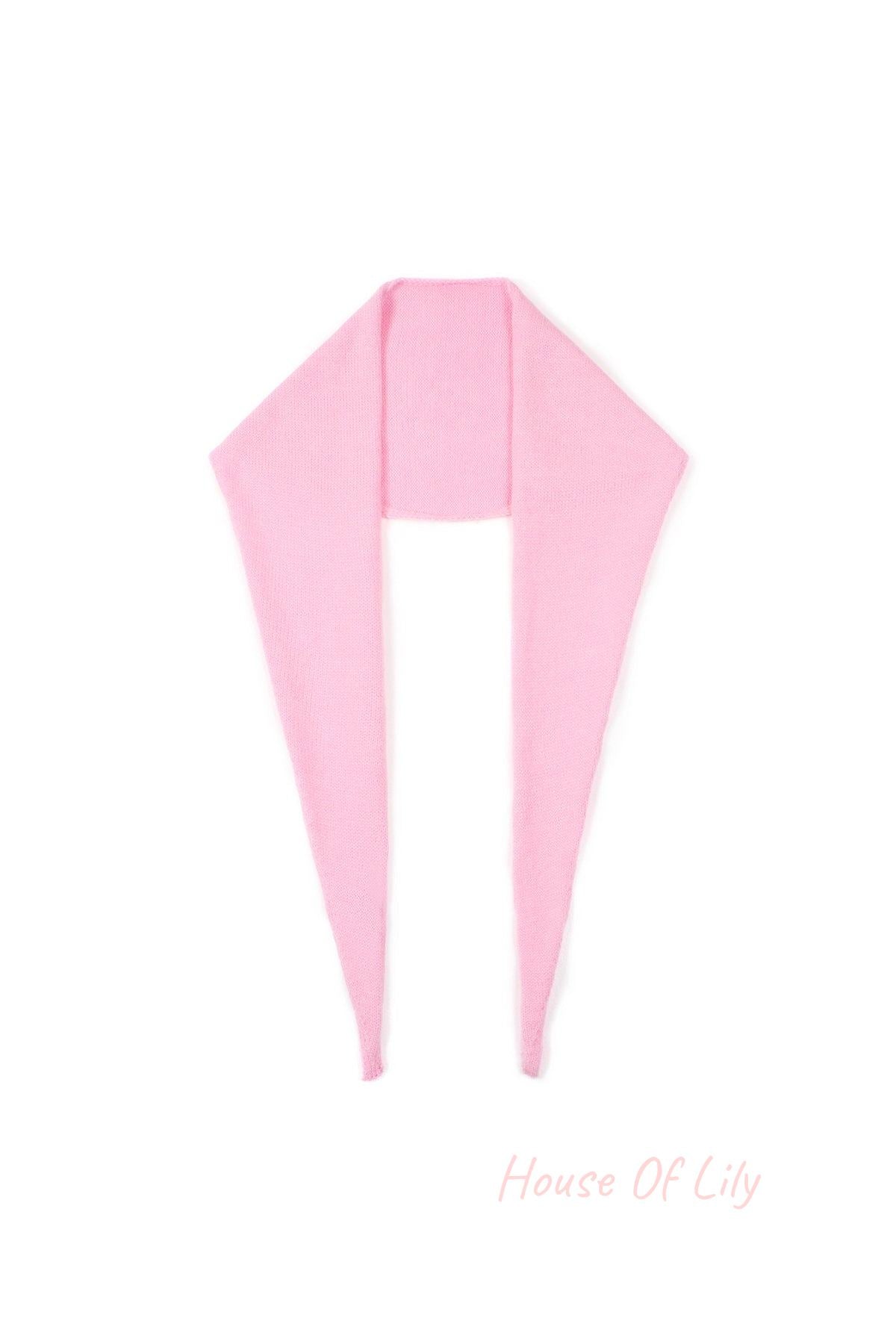 Soft pink knit triangle scarf laid flat