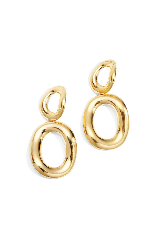 Pair of shiny gold twist oval drop earrings with smooth, organic shapes on white background