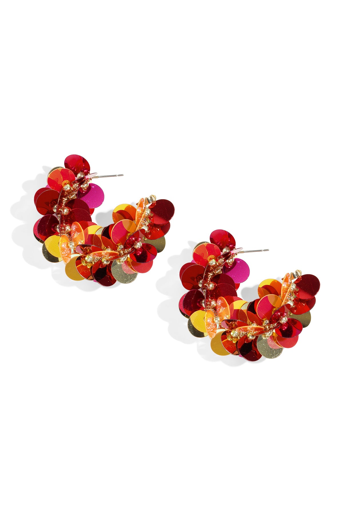 Pair of sequin hoop earrings with red, orange, yellow, and gold circular sequins on white background