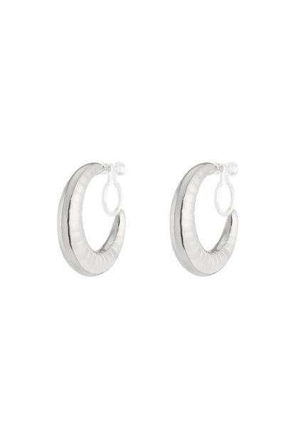 Pair of chunky silver clip-on hoop earrings with ripple texture on white background