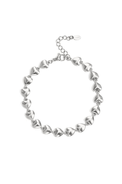 Silver-color chain bracelet featuring linked three-dimensional heart shapes on white background