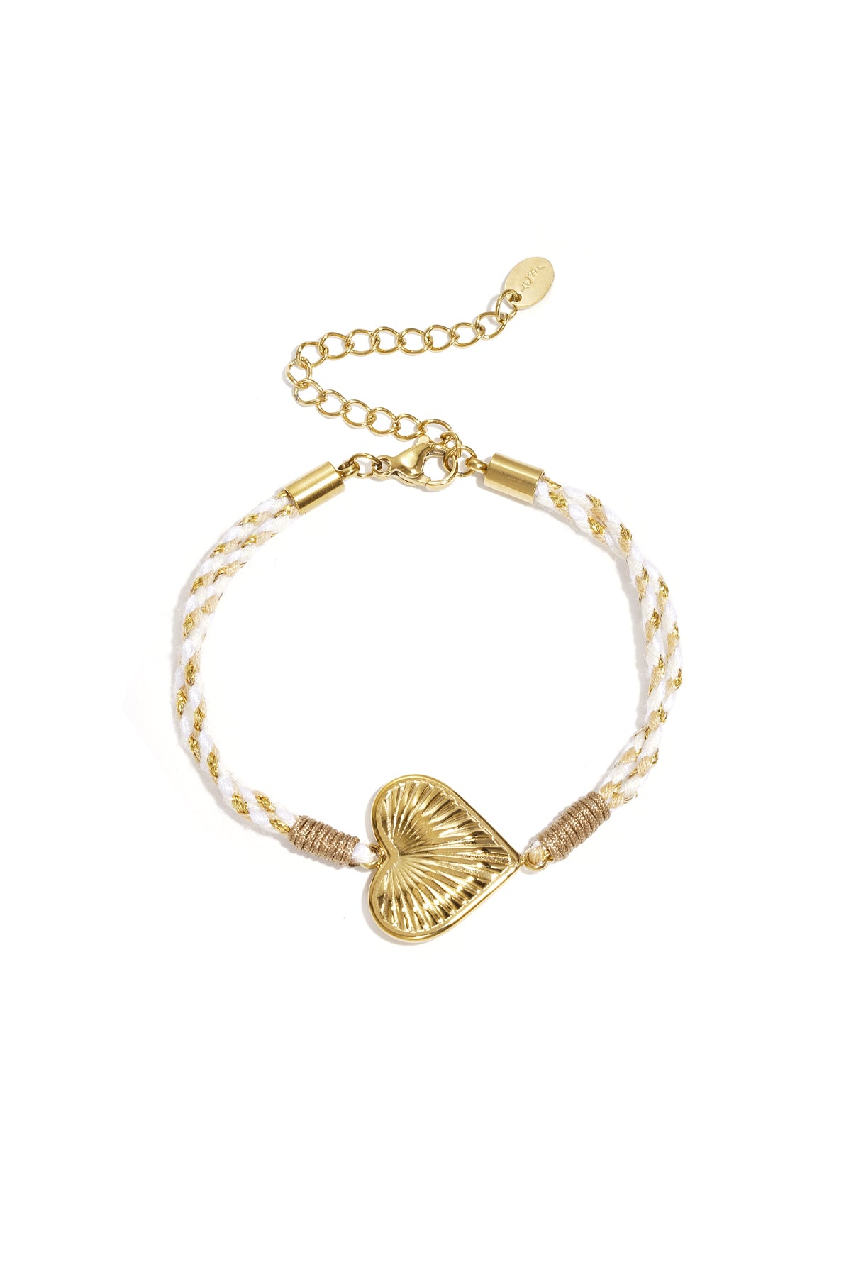 Close-up of a woman's hands touching her face showing off gold rings and multiple bracelets including the lavender flower charm bracelet