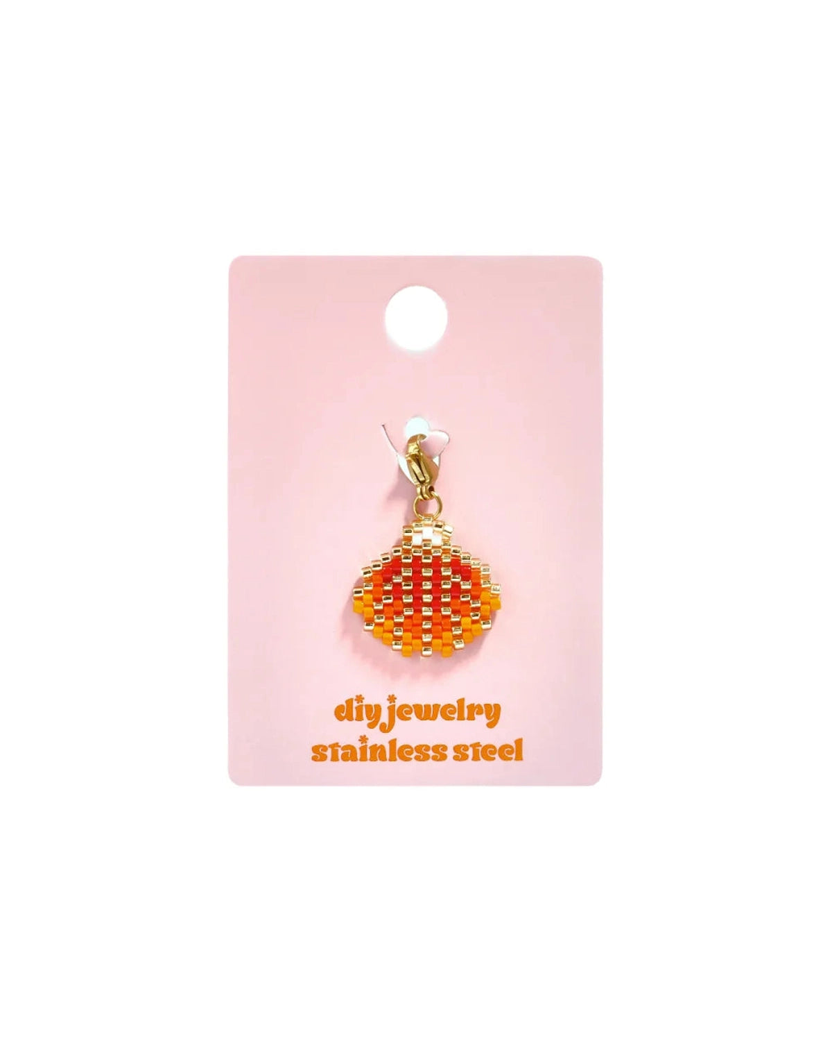 Red and orange beaded shell charm with a gold clasp on a pink display card.
