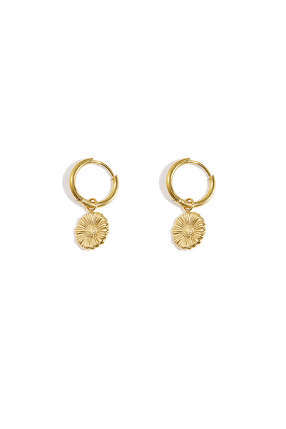 Pair of gold floral charm hoop earrings on white background