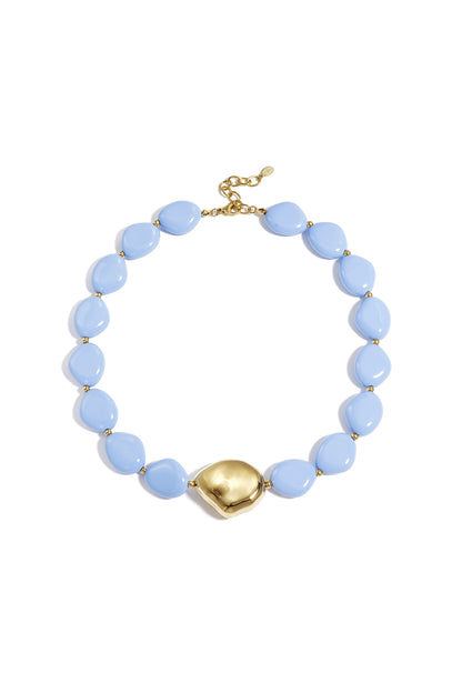 Sky blue beaded necklace with gold-tone center bead and golden clasp displayed on white background