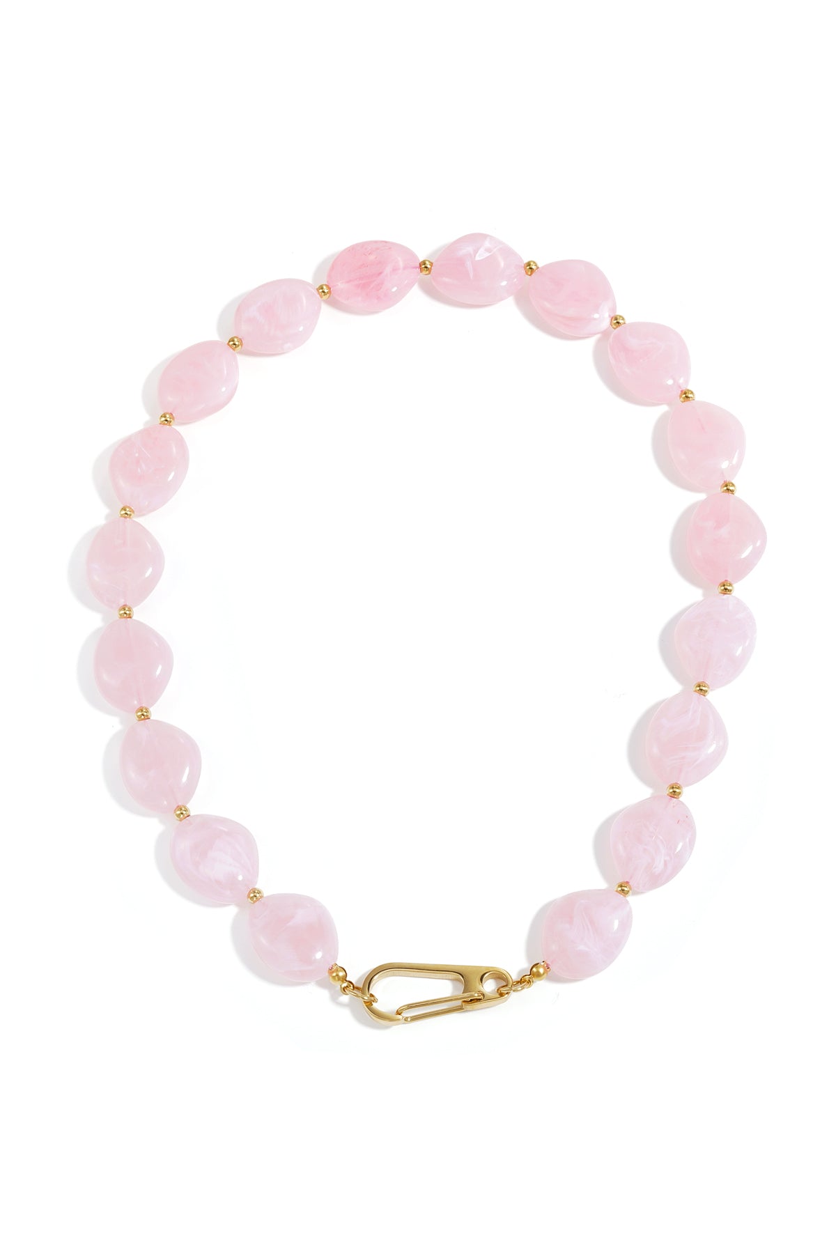 Pastel pink chunky resin beaded necklace laid flat showing glossy irregular beads and gold-tone clasp