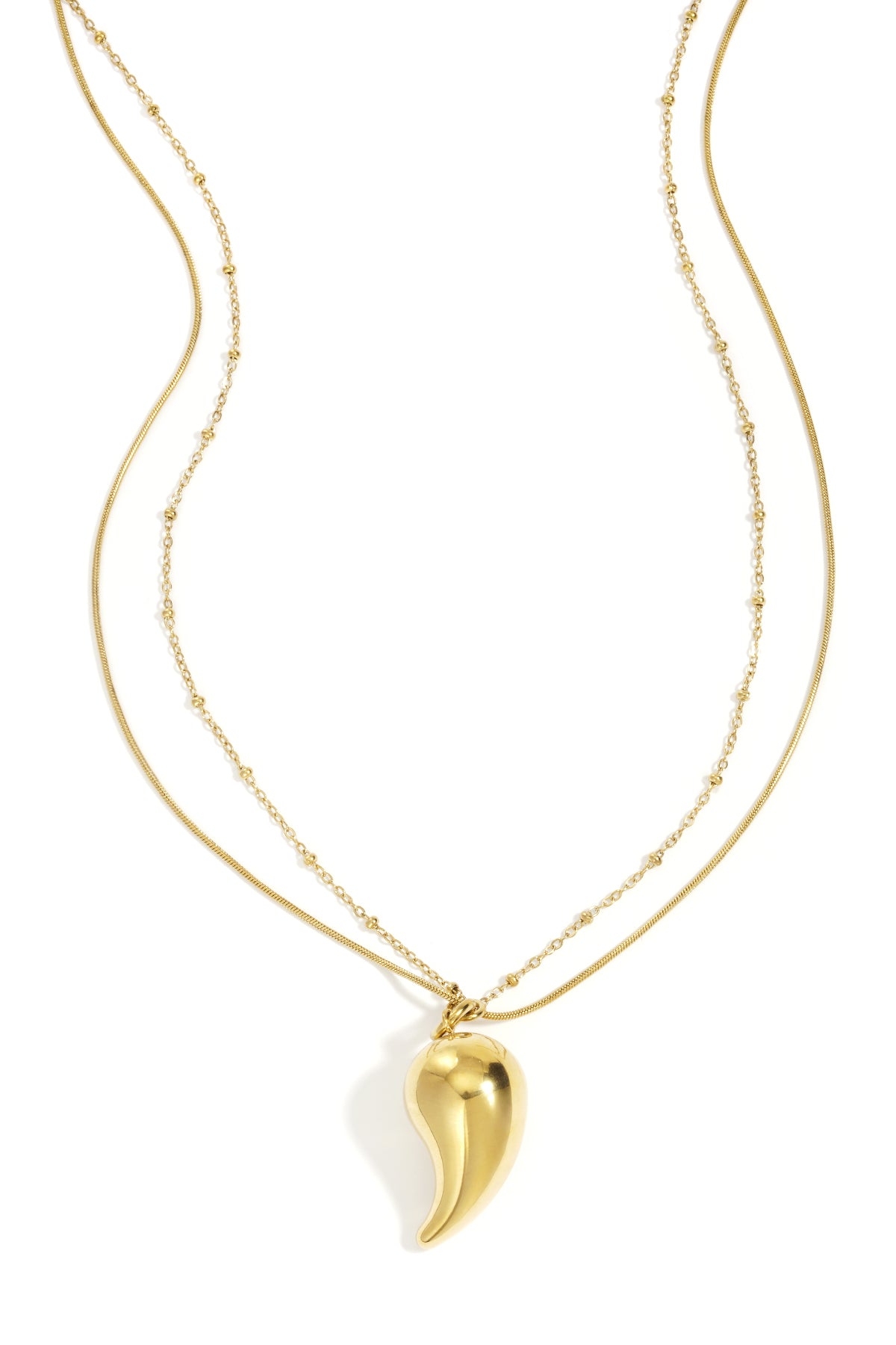 Gold layered necklace with a smooth curved droplet pendant and mixed delicate chains on a white background