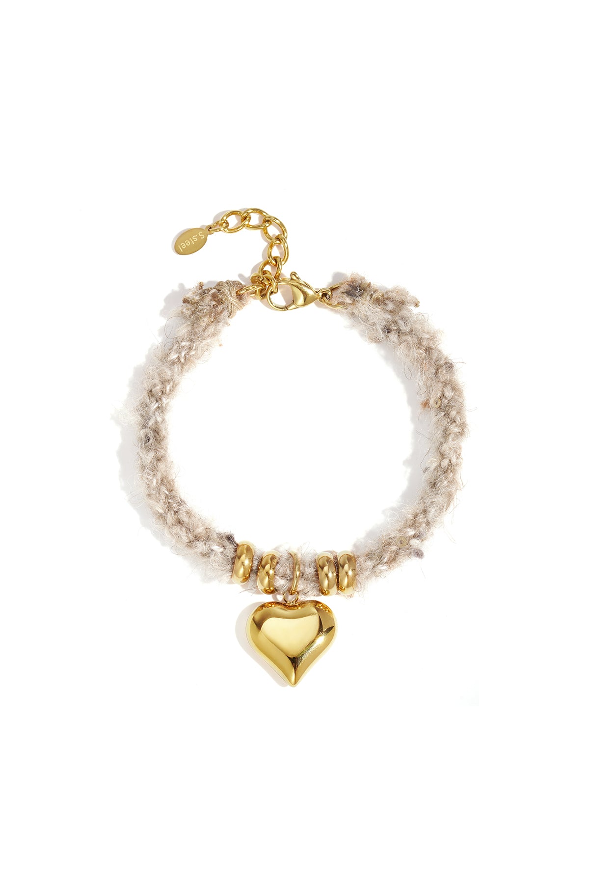 Close-up of a beige knitted bracelet with gold heart charm and gold bead accents on a white background