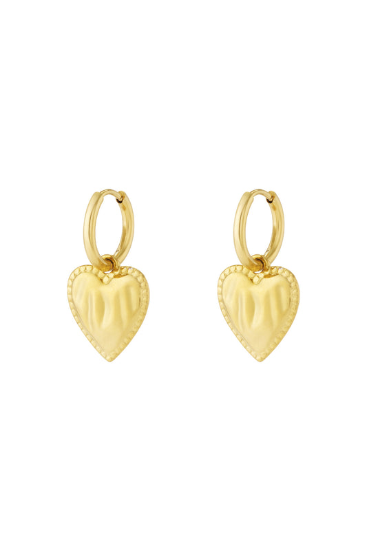 Gold heart charm hoop earrings with beaded edge detail isolated on white background