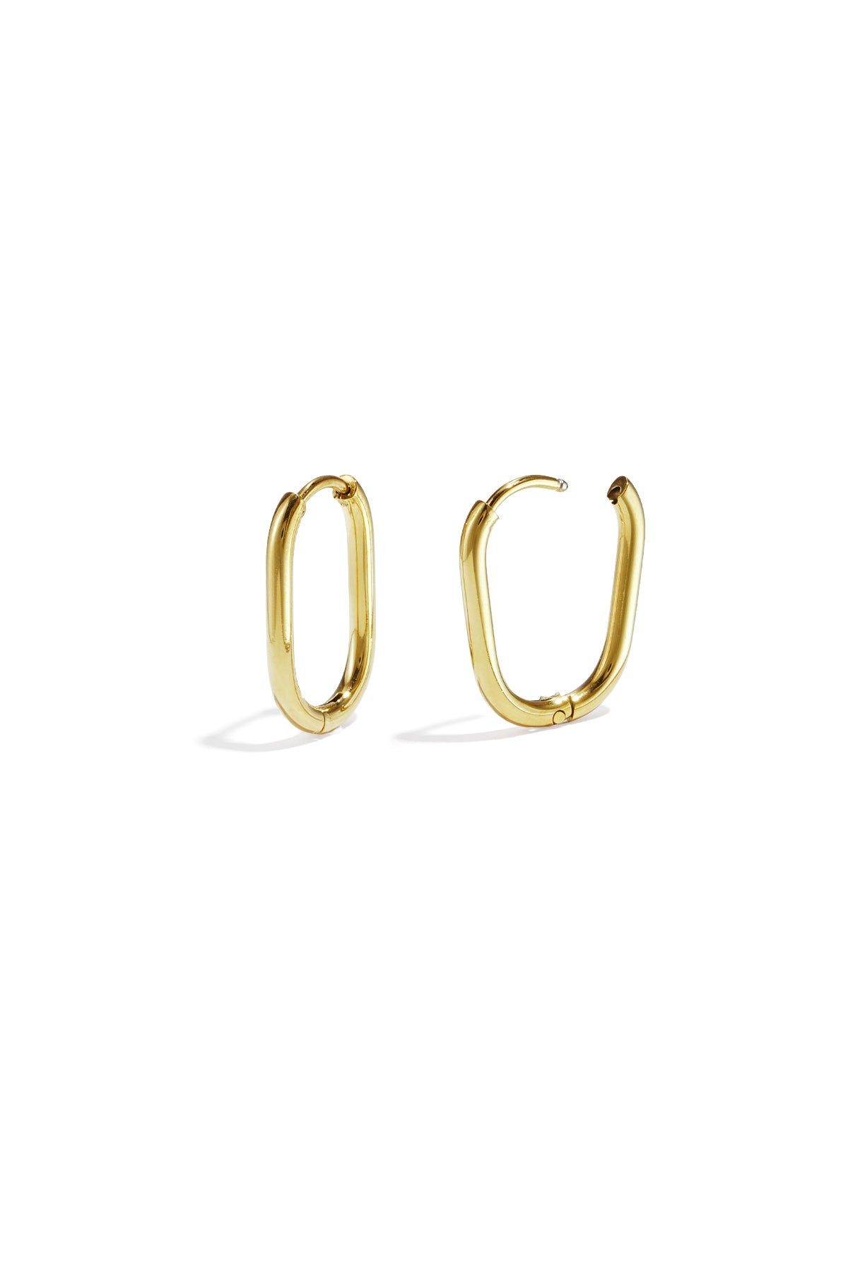 Pair of polished gold oval hoop earrings with snap closure on white background