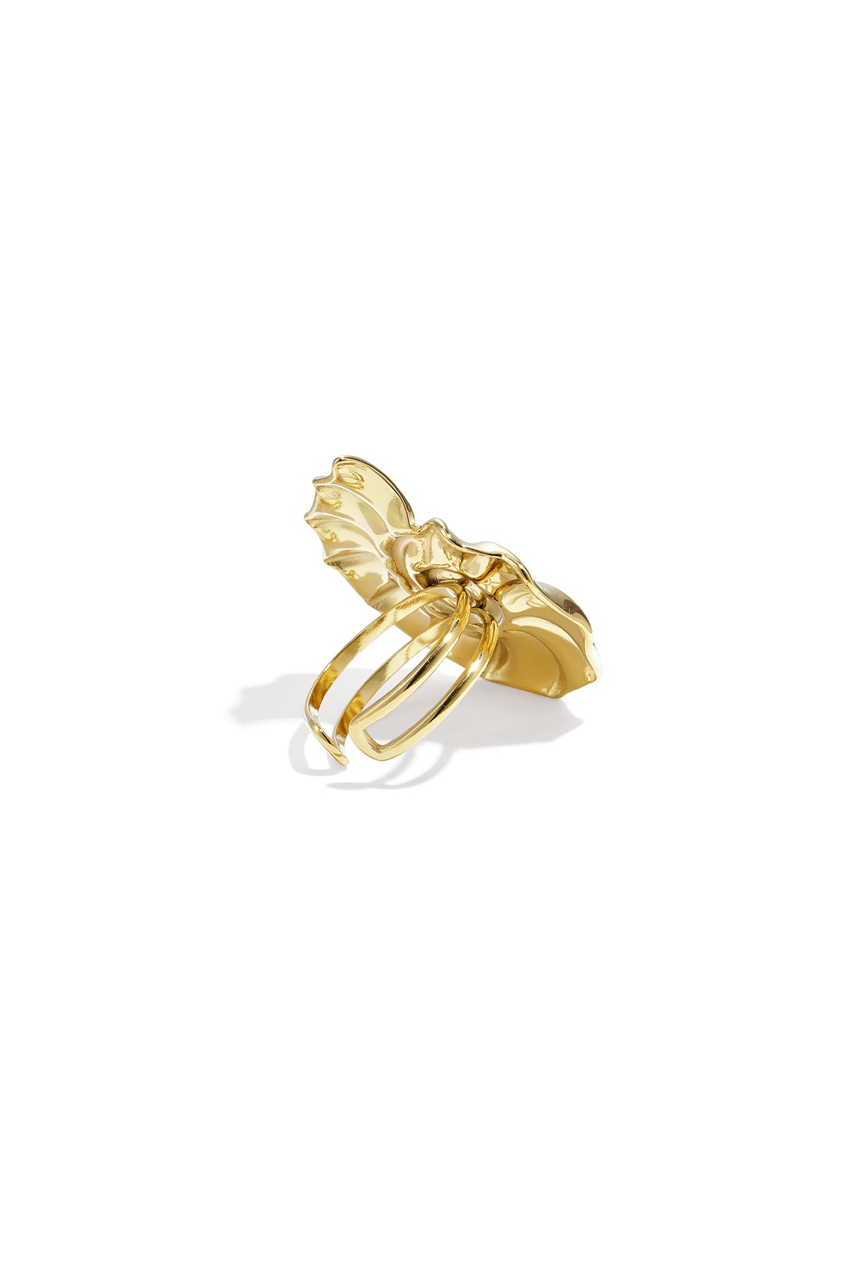 Back view of the adjustable band of the gold spiral shell statement ring on white background
