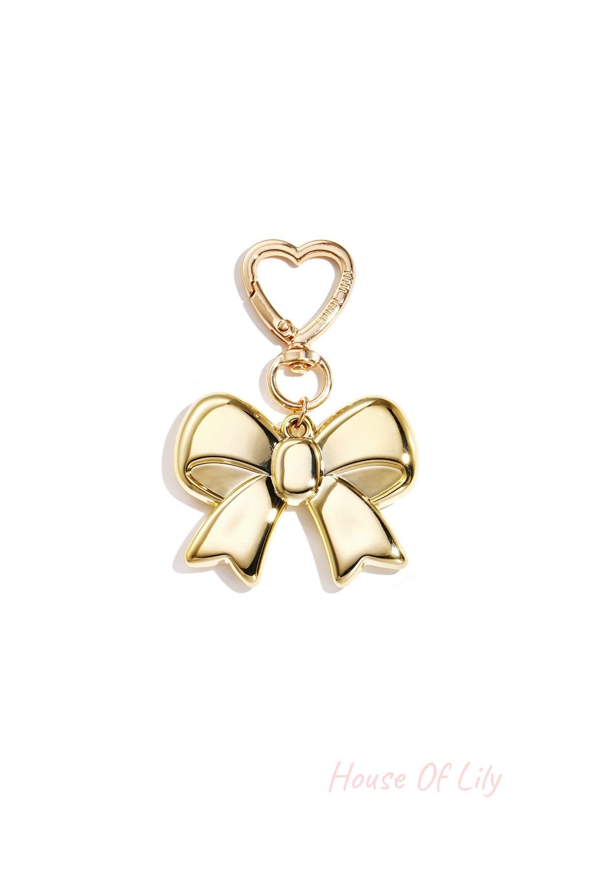 Gold metallic bow keychain with heart-shaped gold clasp on white background