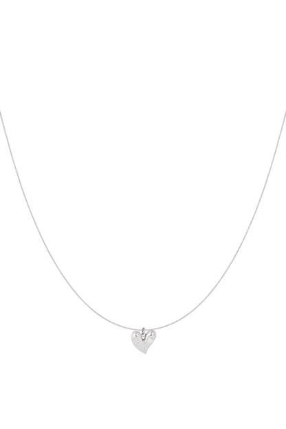 Minimalist silver heart pendant necklace with rhinestones on thin chain isolated on white background
