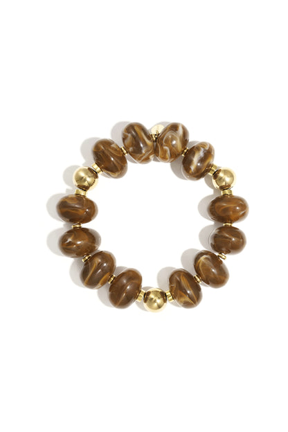 Brown marbled resin beaded bracelet with gold beads on white background